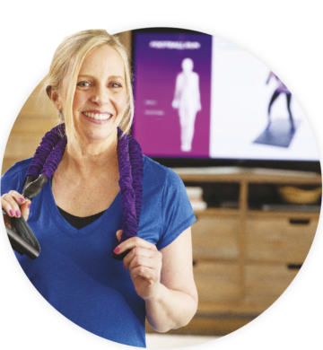 Woman Standing in Front of TV with Resistance Band Around Neck
