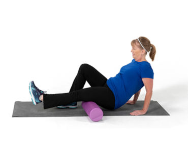 Woman using foam roller