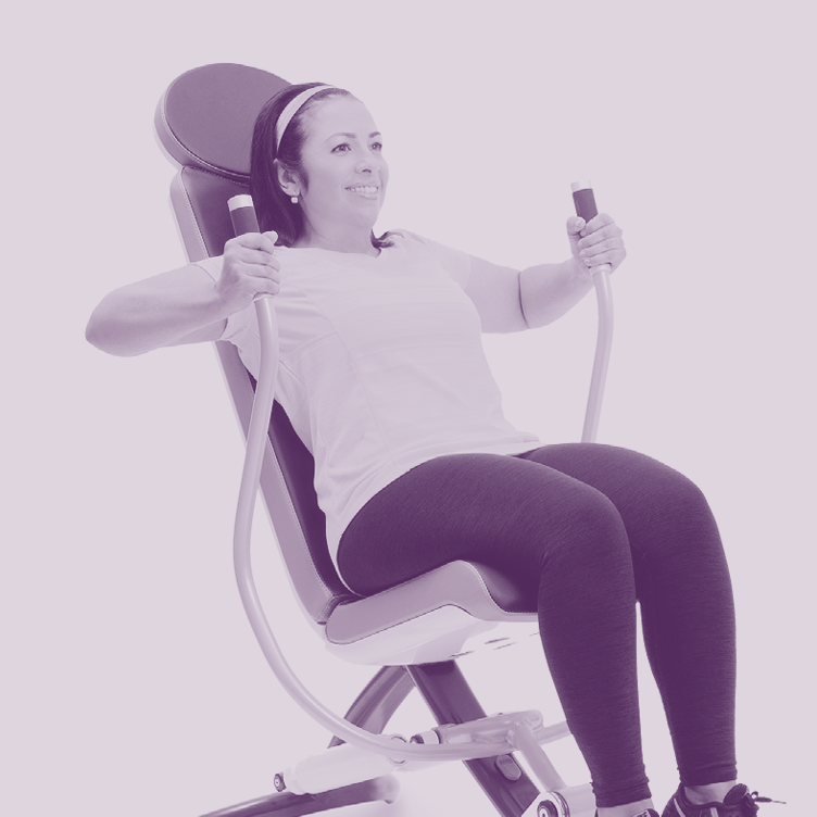 Woman using exercise machine