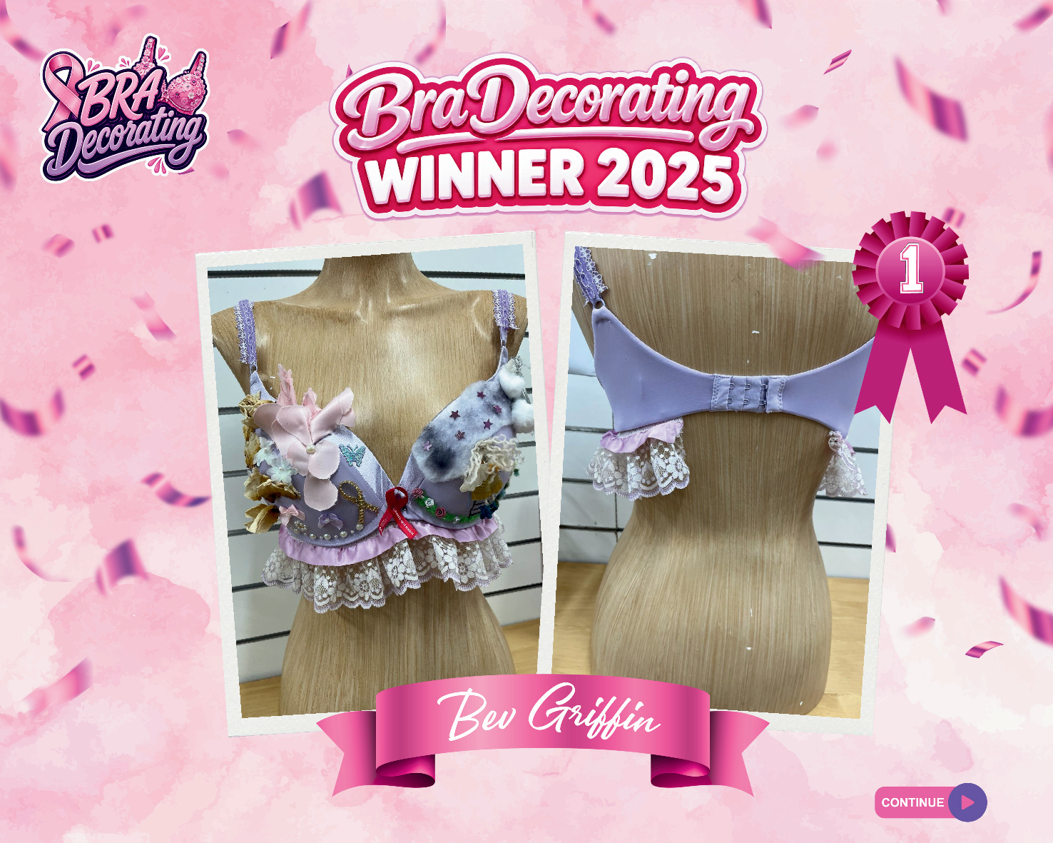 A poignant remembrance design from the Curves Bra Decorating Competition for breast cancer awareness, showing a soft lavender bra featuring a delicate white lace trim skirt, a red ribbon pinned to the center, and a beautiful multi-textured arrangement of soft pink fabric roses and wings on the left cup.